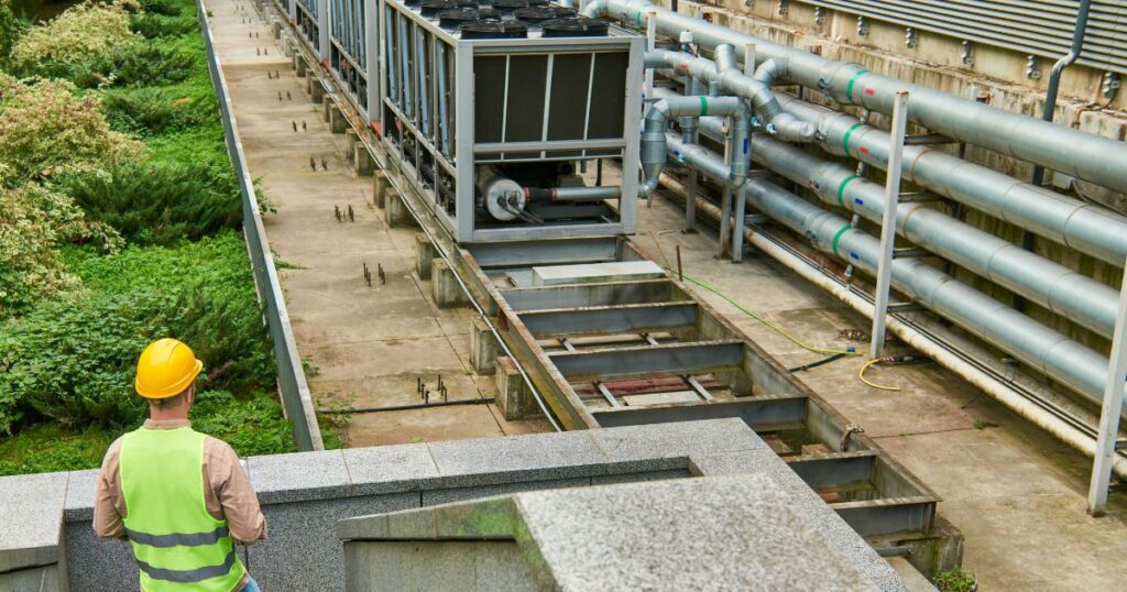 Facilities technician inspecting critical systems as part of backup power readiness and maintenance